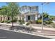 Charming two-story home with light blue siding, well-manicured landscaping, and a welcoming front entrance at 21134 W Green St, Buckeye, AZ 85396