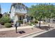 Inviting two-story home boasting well-kept landscaping, complemented by a mature tree and a cozy entrance at 21134 W Green St, Buckeye, AZ 85396