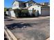 Exterior angle of home, featuring a partial view of a balcony and a detached two-car garage at 21134 W Green St, Buckeye, AZ 85396
