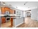Open kitchen with stainless appliances, center island, and gas range at 21134 W Green St, Buckeye, AZ 85396