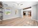 Bright, open living room featuring wood floors and abundant natural light at 21134 W Green St, Buckeye, AZ 85396