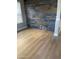 The living room offers wood-look flooring and a feature wall with stylish outlets at 21134 W Green St, Buckeye, AZ 85396