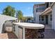 Outdoor kitchen with stone accents, built-in grill, and mini fridge, ideal for gatherings at 21134 W Green St, Buckeye, AZ 85396