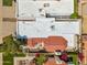 An aerial shot showcasing the home's unique roof design surrounded by lush landscaping and neighboring properties at 2170 E Alameda Dr, Tempe, AZ 85282