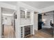 Stylish bar area with a wine refrigerator and glass cabinet, perfect for entertaining at 2170 E Alameda Dr, Tempe, AZ 85282