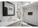 Stylish bathroom features a modern shower with sleek, white tiling and a contemporary vanity with a black framed mirror at 2170 E Alameda Dr, Tempe, AZ 85282