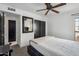 Bright bedroom with ceiling fan and nearby closet and ensuite bathroom at 2170 E Alameda Dr, Tempe, AZ 85282
