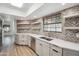 Bright kitchen with modern countertops, stainless steel appliances, and decorative backsplash at 2170 E Alameda Dr, Tempe, AZ 85282