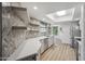 Contemporary kitchen featuring stainless steel appliances, modern gray cabinets, and a bright skylight at 2170 E Alameda Dr, Tempe, AZ 85282