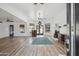 Bright and open living room featuring wood floors, a fireplace, and a wet bar at 2170 E Alameda Dr, Tempe, AZ 85282