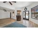 Spacious living room featuring wood floors, a wet bar, and views of the backyard at 2170 E Alameda Dr, Tempe, AZ 85282