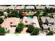 Stunning aerial view of a home with a sparkling blue pool and lush green landscaping at 22290 E Escalante Rd, Queen Creek, AZ 85142