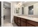 This bathroom has a double sink with plenty of counter space and updated fixtures at 22290 E Escalante Rd, Queen Creek, AZ 85142