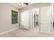 Bedroom featuring a window, closet, and doorway looking into another room at 22290 E Escalante Rd, Queen Creek, AZ 85142