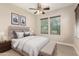 Bedroom featuring a ceiling fan, two windows with window coverings and neutral decor at 22290 E Escalante Rd, Queen Creek, AZ 85142