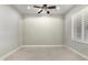 Minimalist bedroom with a ceiling fan, shuttered windows, light-colored walls and flooring, and modern lighting at 22290 E Escalante Rd, Queen Creek, AZ 85142