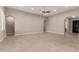 Spacious living room with tile floors, recessed lighting, and archway details create an open and inviting space at 22290 E Escalante Rd, Queen Creek, AZ 85142