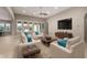 Bright, inviting living space with neutral tones, modern furnishings, and expansive windows for natural light at 22290 E Escalante Rd, Queen Creek, AZ 85142