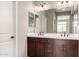 Bathroom with double sink vanity, and dark wood cabinets at 23195 S 226Th Way, Queen Creek, AZ 85142