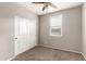 This bedroom has neutral walls, carpet flooring, a window for natural light, and a double door closet at 23195 S 226Th Way, Queen Creek, AZ 85142