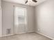 This bedroom features neutral walls, carpet flooring, and a window for natural light at 23195 S 226Th Way, Queen Creek, AZ 85142