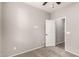The bedroom has neutral walls and carpet flooring with an open door to another room at 23195 S 226Th Way, Queen Creek, AZ 85142
