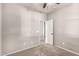 The bedroom has neutral walls and carpet flooring and an open door to another room at 23195 S 226Th Way, Queen Creek, AZ 85142