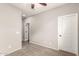 The bedroom has neutral walls and carpet flooring with an open door to another room at 23195 S 226Th Way, Queen Creek, AZ 85142
