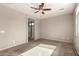 Spacious bedroom featuring neutral carpet, ceiling fan, and ample natural light at 23195 S 226Th Way, Queen Creek, AZ 85142