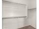 Walk in closet with carpeted floors and white shelving at 23195 S 226Th Way, Queen Creek, AZ 85142