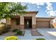 Inviting single-story home featuring a well-maintained front yard and a welcoming covered porch at 23195 S 226Th Way, Queen Creek, AZ 85142