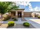 Inviting single-story home featuring a well-maintained front yard and a welcoming covered porch at 23195 S 226Th Way, Queen Creek, AZ 85142