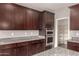 Close up of modern kitchen showing built in microwave, ovens and granite countertops at 23195 S 226Th Way, Queen Creek, AZ 85142