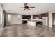 Open kitchen featuring dark cabinetry, stainless steel appliances, granite countertops, and a center island at 23195 S 226Th Way, Queen Creek, AZ 85142