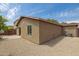 Low maintenance backyard with gravel, a small patio, and a tan stucco exterior at 2327 E Meadow Land Dr, San Tan Valley, AZ 85140