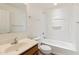 Bright bathroom featuring a shower-tub combo, vanity, and tile flooring at 2327 E Meadow Land Dr, San Tan Valley, AZ 85140