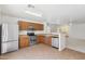 The kitchen features tile flooring, stainless steel appliances, and wooden cabinets at 2327 E Meadow Land Dr, San Tan Valley, AZ 85140