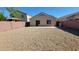 A private backyard featuring a patio and low-maintenance landscaping, perfect for outdoor enjoyment at 23424 W Pima St, Buckeye, AZ 85326
