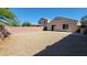 A private backyard featuring a patio and low-maintenance landscaping, perfect for outdoor enjoyment at 23424 W Pima St, Buckeye, AZ 85326