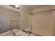 Bathroom with single sink vanity, laminate countertops, toilet, and tub shower at 23424 W Pima St, Buckeye, AZ 85326