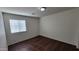 Empty bedroom with window and hard surface flooring at 23424 W Pima St, Buckeye, AZ 85326