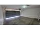 This large garage with an automatic door opener offers space for vehicles and extra storage at 23424 W Pima St, Buckeye, AZ 85326