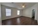 Open concept living room with ceiling fan and hard surface floors at 23424 W Pima St, Buckeye, AZ 85326