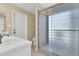 Bathroom featuring white tile countertops, glass shower and white fixtures at 2346 E Jasmine St, Mesa, AZ 85213