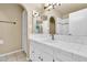 Bathroom featuring a single sink vanity with tile counters and shower at 2346 E Jasmine St, Mesa, AZ 85213