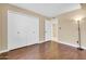Bright bedroom with closet and laminate flooring providing space and storage at 2346 E Jasmine St, Mesa, AZ 85213