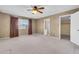 Bedroom with textured walls, carpet, a window and an en suite bathroom at 2346 E Jasmine St, Mesa, AZ 85213