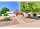 Charming single-story home featuring a well-manicured front yard with desert landscaping and a cozy covered entry at 2346 E Jasmine St, Mesa, AZ 85213
