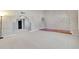Expansive living space featuring neutral colored carpet, unique architectural arches, and ample room for customization at 2346 E Jasmine St, Mesa, AZ 85213