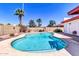 Refreshing pool surrounded by rock landscaping and mature shade trees, great for relaxation at 2346 E Jasmine St, Mesa, AZ 85213
